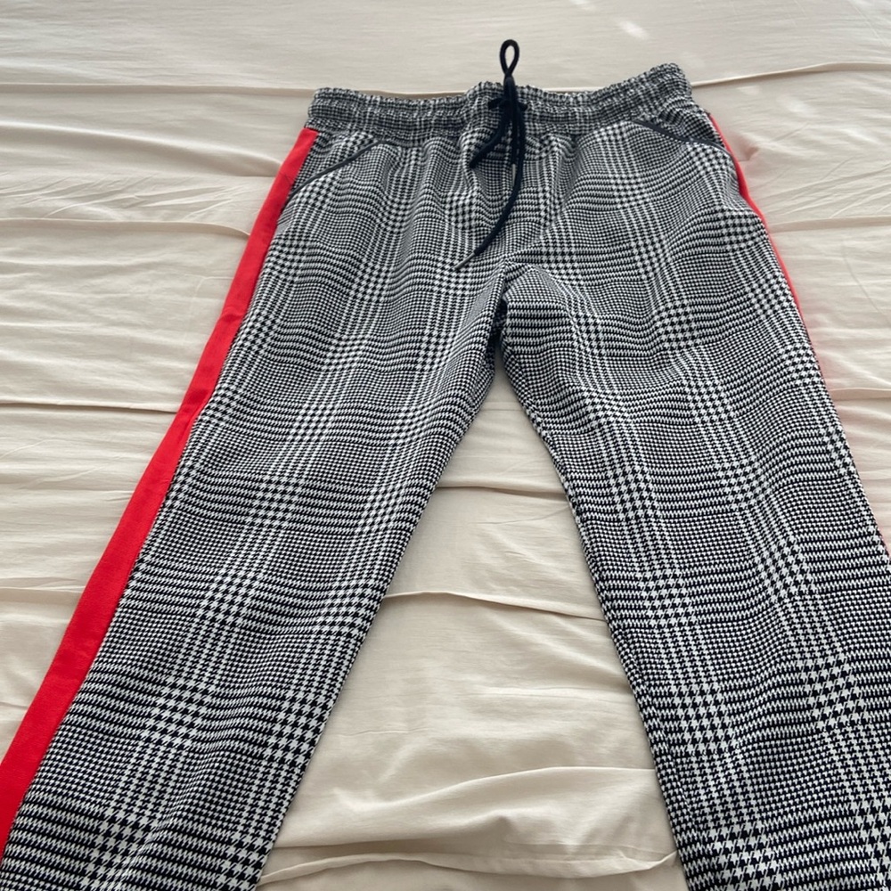 Super cute pants with red stripes on sides